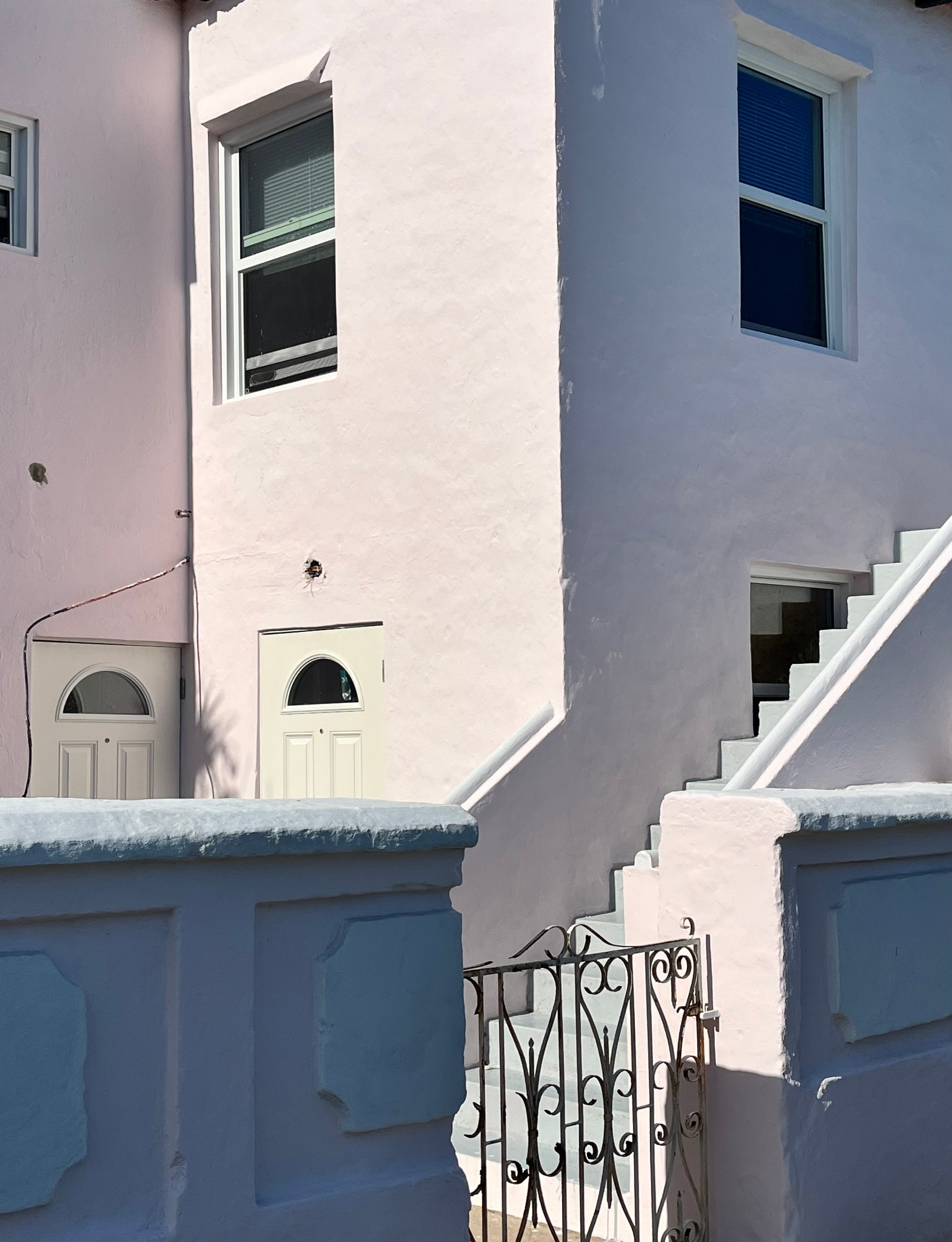 Geometric detail of a pale pink Bermuda house